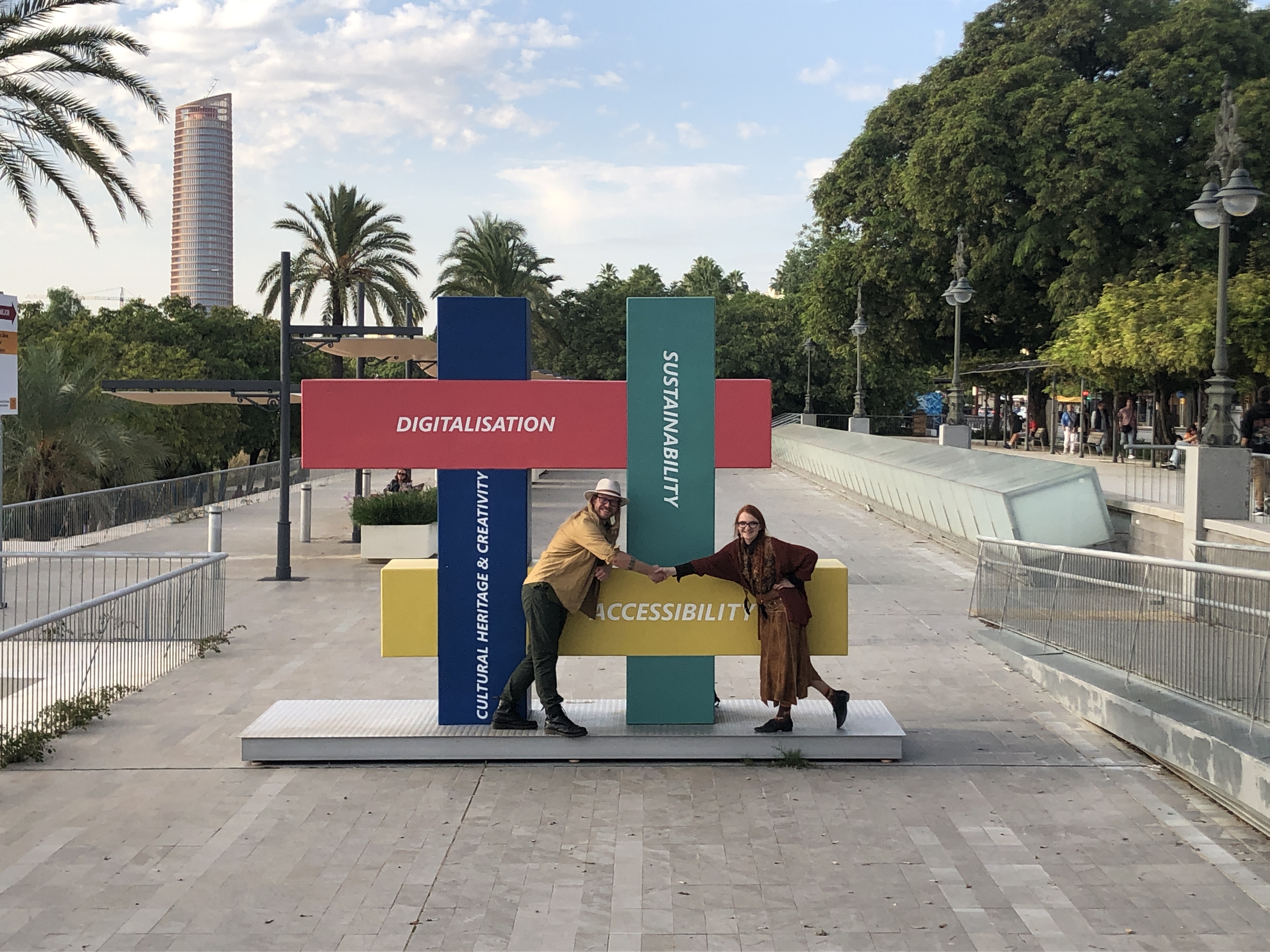 About us photo Us shaking hands in Seville